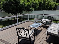 <b>Trex Transcend Spiced Rum Deck Boards with White Lincoln Vinyl Railing, Black Round Aluminum Balusters and matching cocktail rail-black eyeball lights in Ellicott City MD</b>